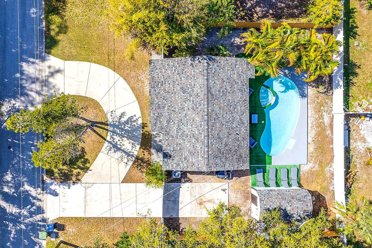 Aerial top view of our beautiful property and the stunning surroundings. Enjoy the view outside showcasing beautiful properties in the area. If you like this property, please send us an inquiry right away!