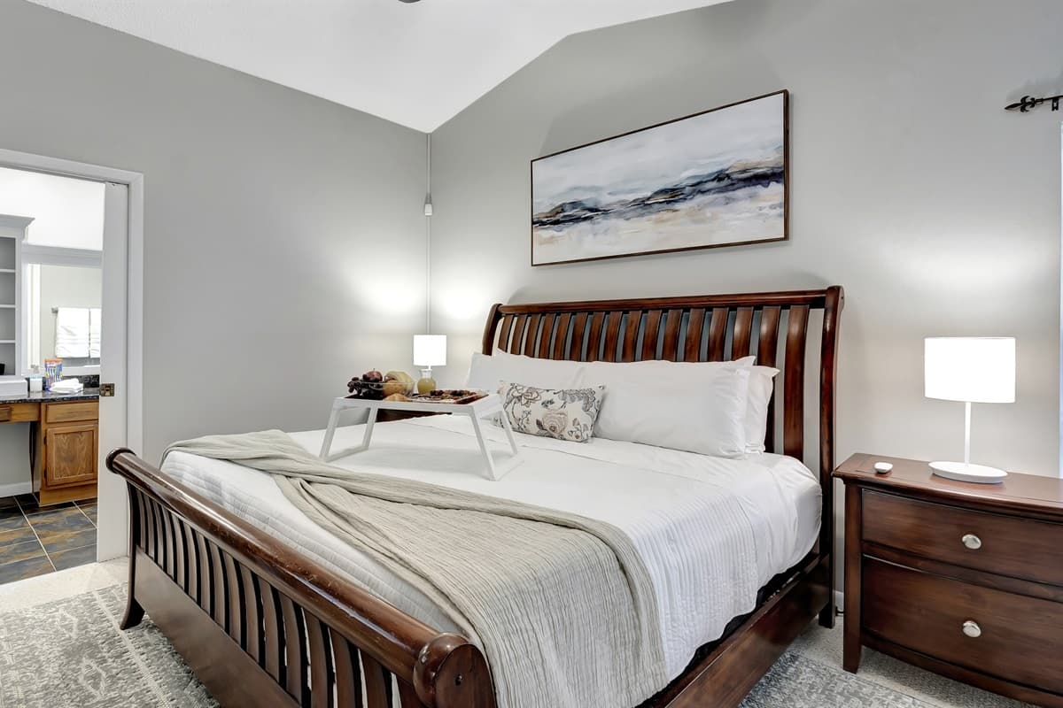 Experience the epitome of comfort in the Master's bedroom, where a grand king-size bed welcomes you to unparalleled luxury.