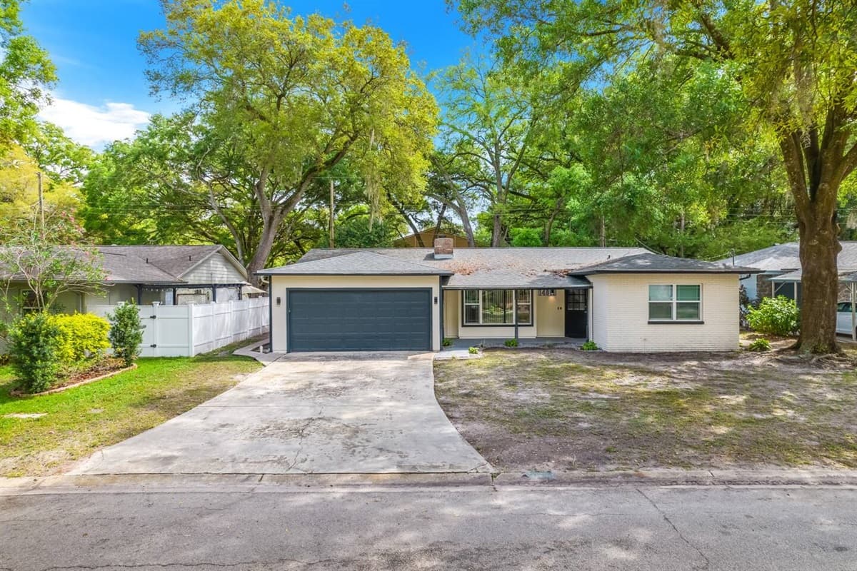 The stunning front side view of the house showcasing our magnificent front yard, amazing tree, and driveway. If you are interested in this property, don't hesitate to send us a message!