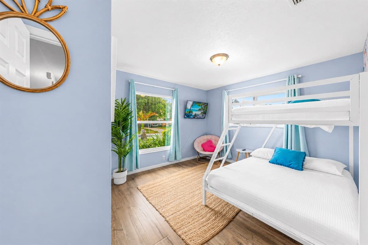 Comfortable sleeping setup with bunk beds and a cheerful, airy layout.