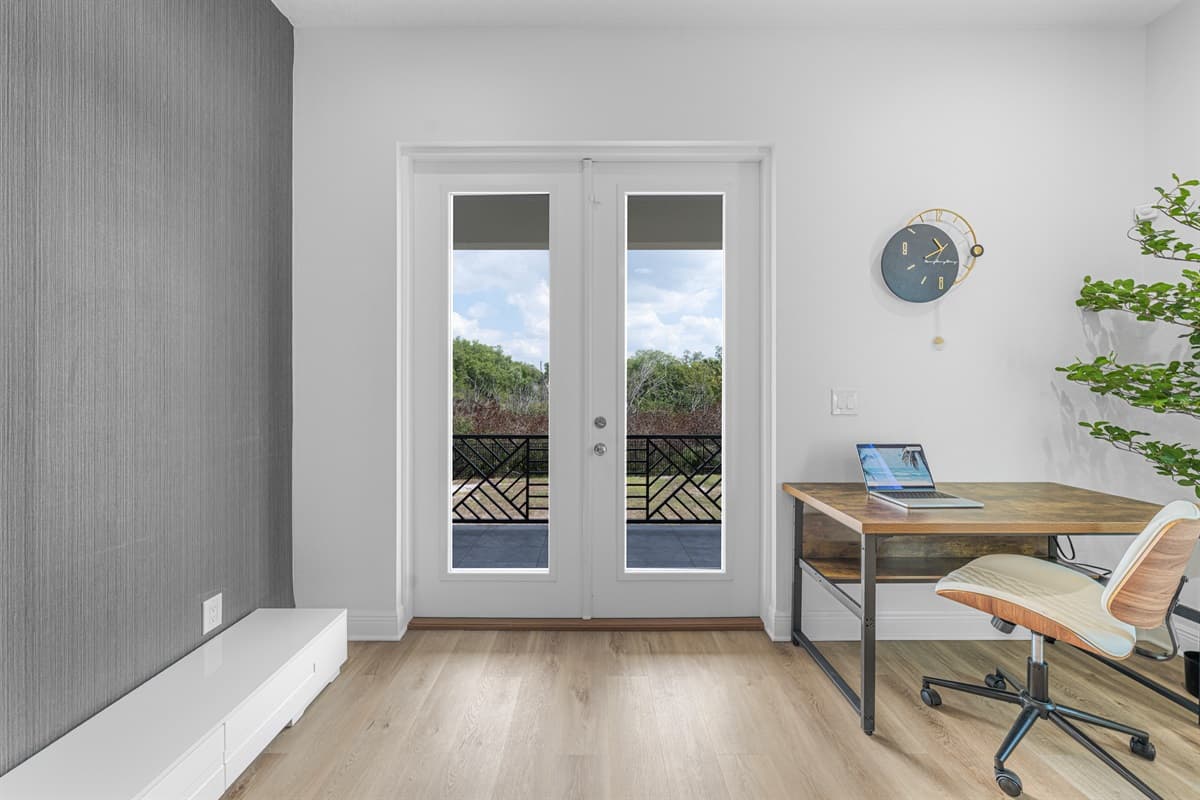 Dedicated workspace area with desk, chair, and natural lighting—ideal for remote work or studying.