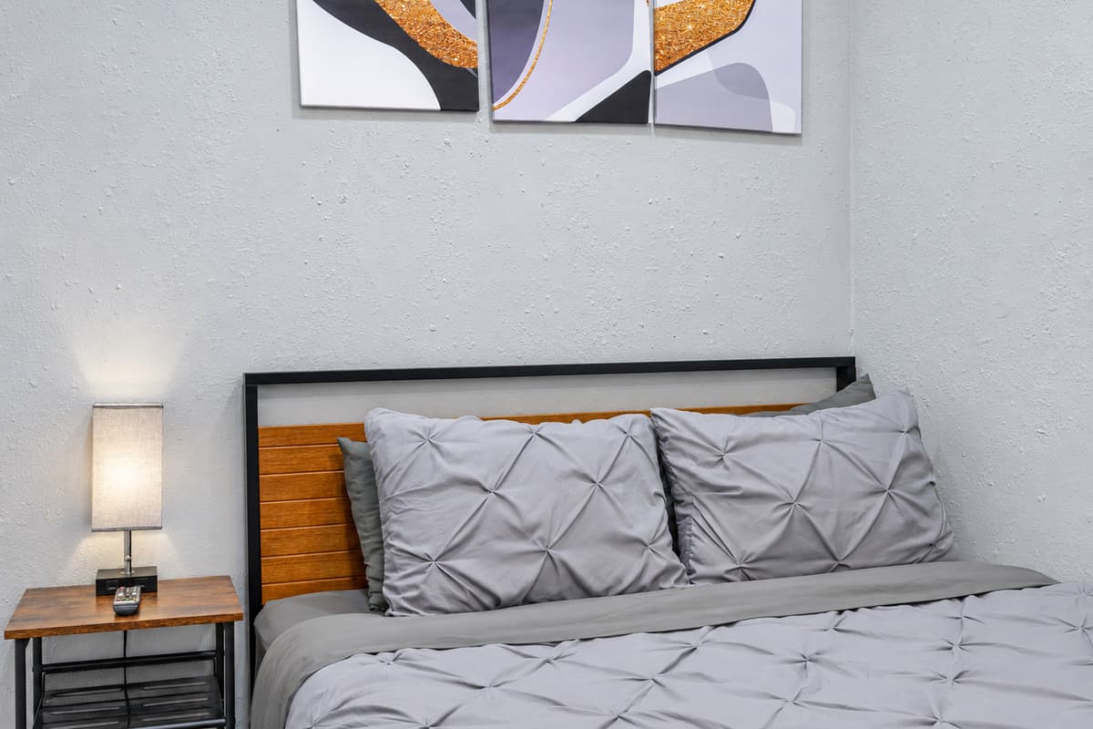 Cozy bedroom with a queen-sized bed, smart TV, and drawers for storage. This bedroom will surely make your stay in this property the best among others. Please send us an inquiry as soon as possible!