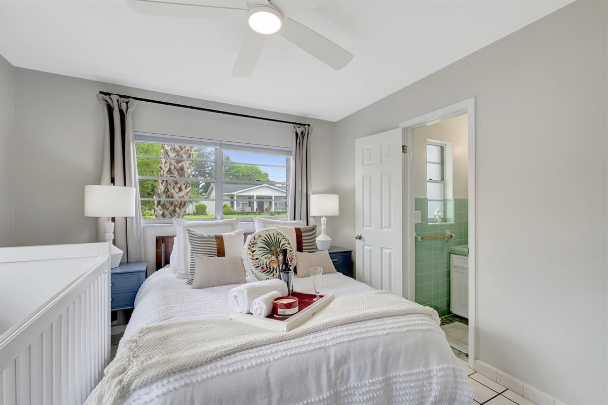 In the heart of this bedroom, you'll find a luxurious queen-size bed that beckons you to unwind and sink into a sea of comfort.