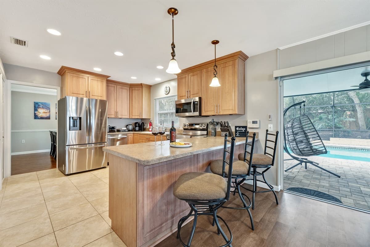 Natural light pours in through well-placed windows, infusing the space with a warm and inviting glow that enhances the overall culinary experience.