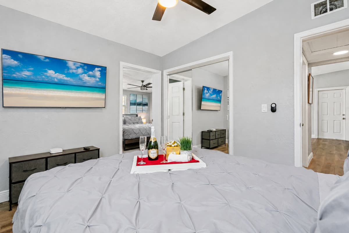 The room also boasts a ceiling fan, which gently circulates the air and creates a cool and comfortable environment.