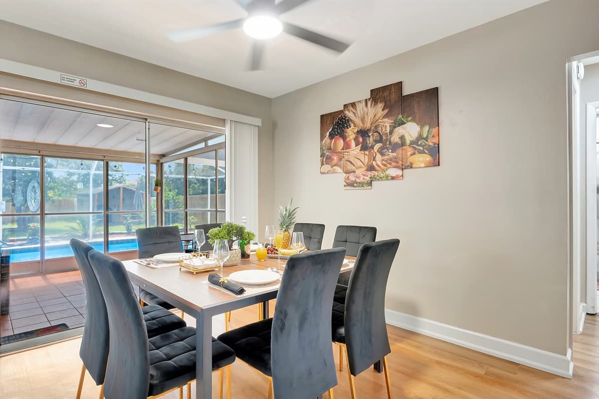 The centerpiece of this space is an expansive 8-seater dining table, providing ample room for you and your guests to savor delightful meals and engaging conversations.
