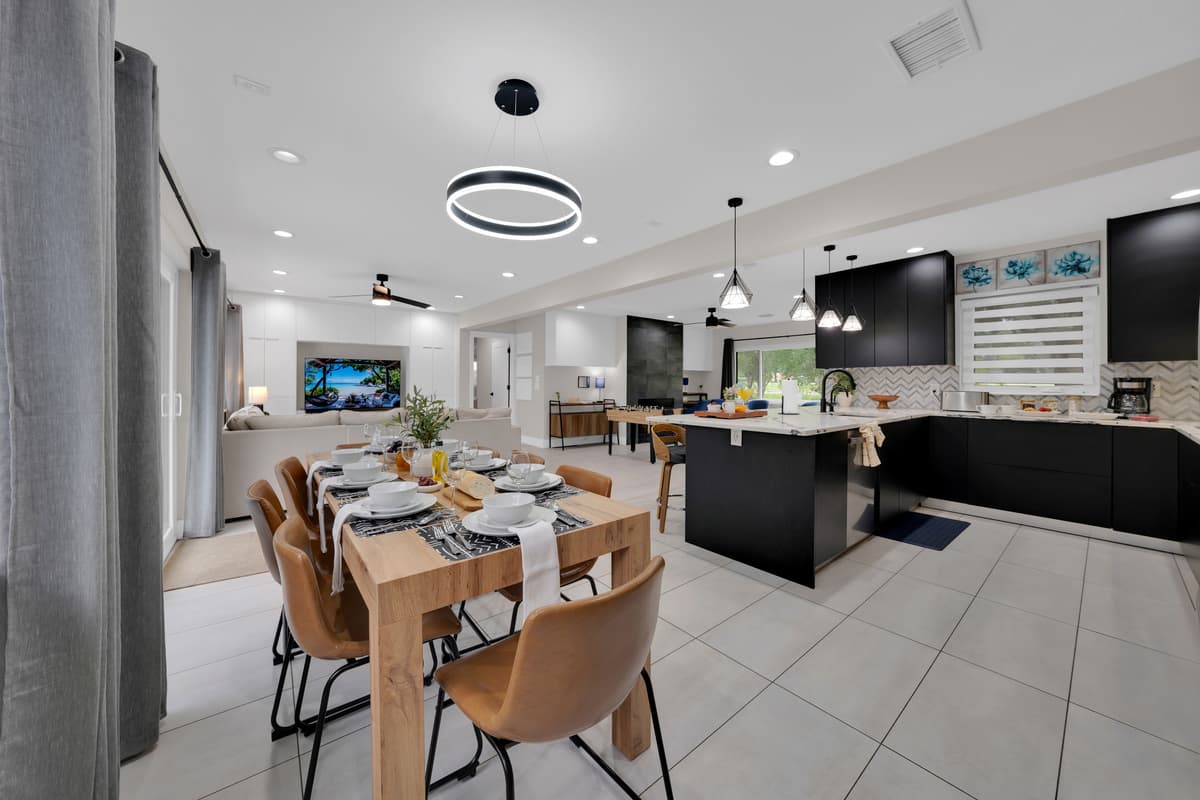 A spacious open-plan setting where dining, cooking, and entertainment come together beautifully