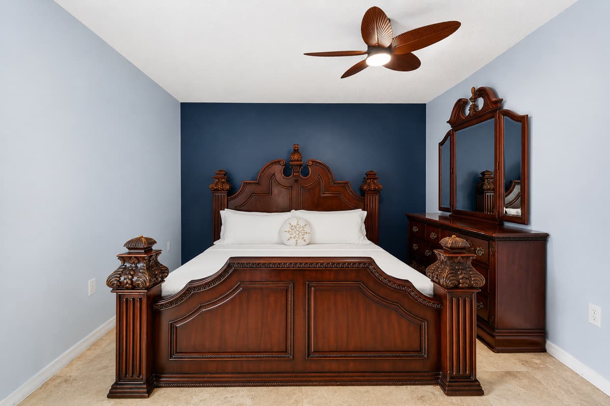 Spacious bedroom featuring a comfortable king-size bed and elegant furnishings for restful nights.