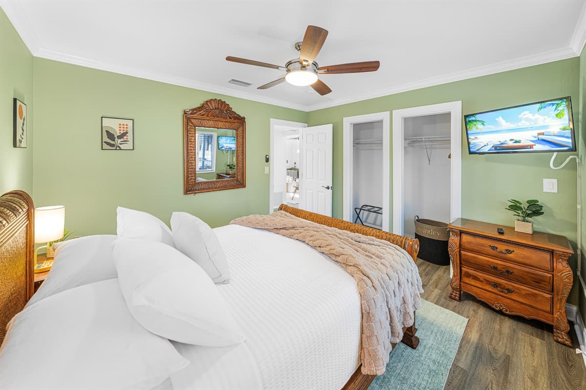 The bedroom features a cozy queen-size bed and soothing décor, creating a relaxing retreat.