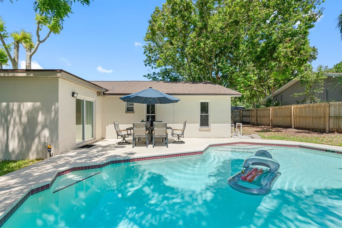 The pool area is thoughtfully designed to accommodate both active and leisurely pursuits, ensuring there's something for everyone.
