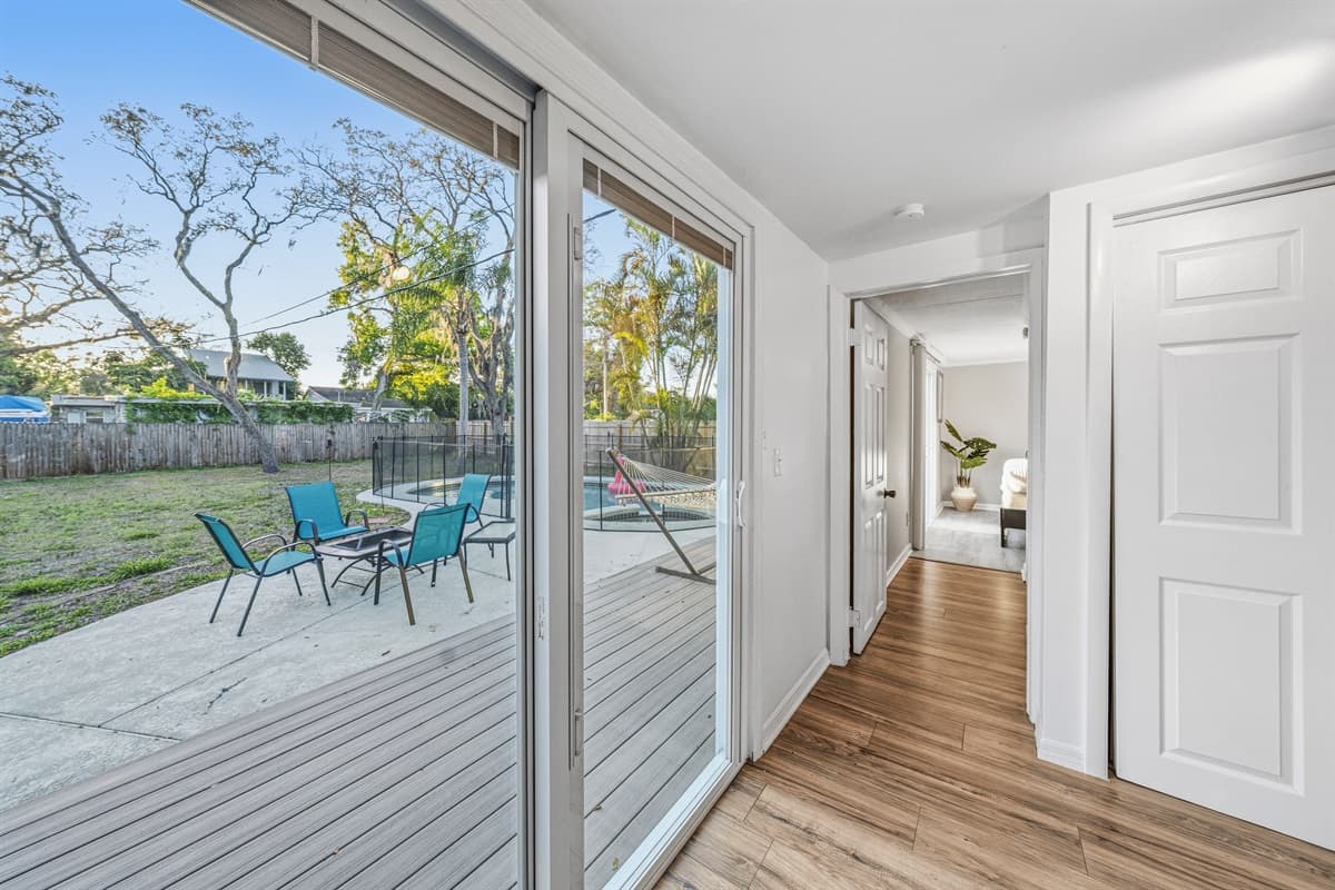 Sliding doors leading to the backyard and pool area for seamless outdoor access.