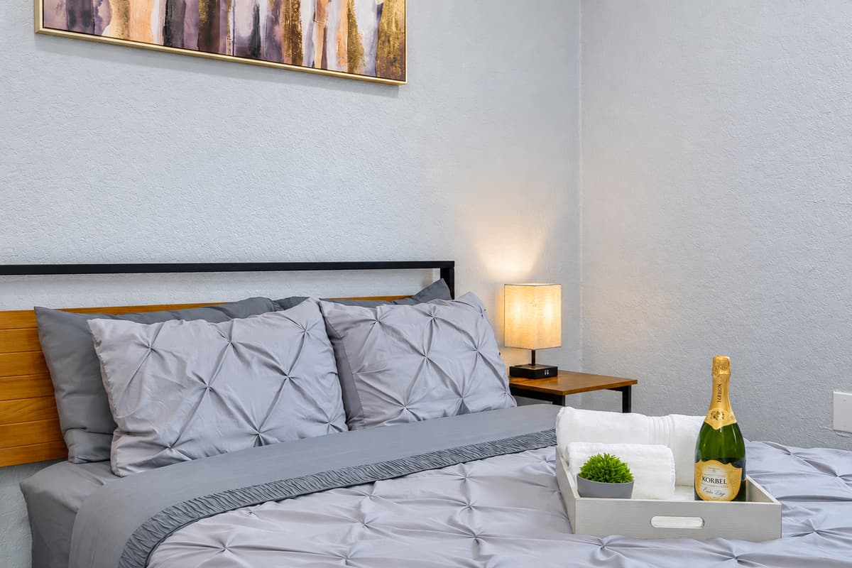 A little celebration on arrival. Fresh bedding and a welcome tray set the tone for the trip, whether it's a family reunion, a birthday, or a long-awaited beach week.