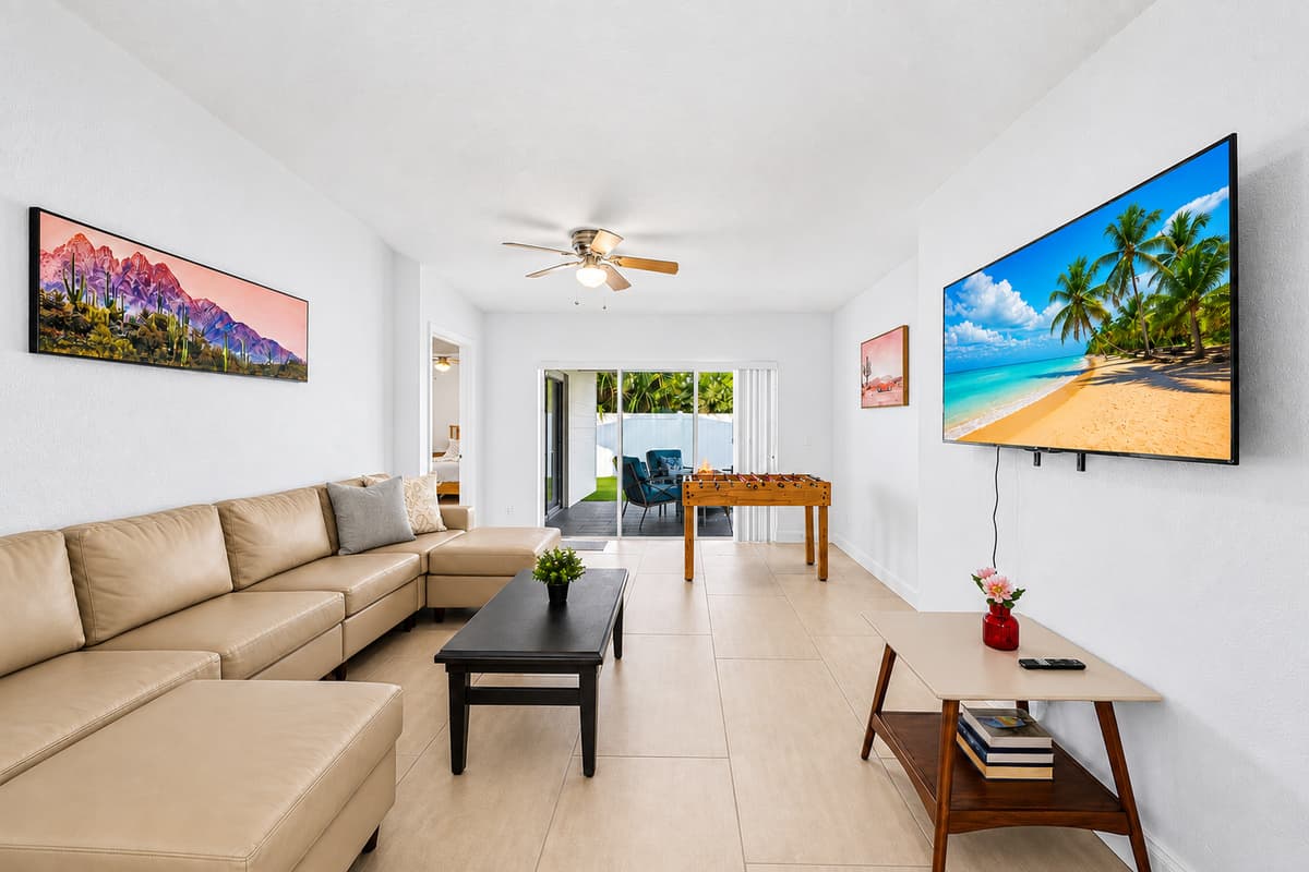 Spacious living area with open layout, comfortable seating, and entertainment amenities.