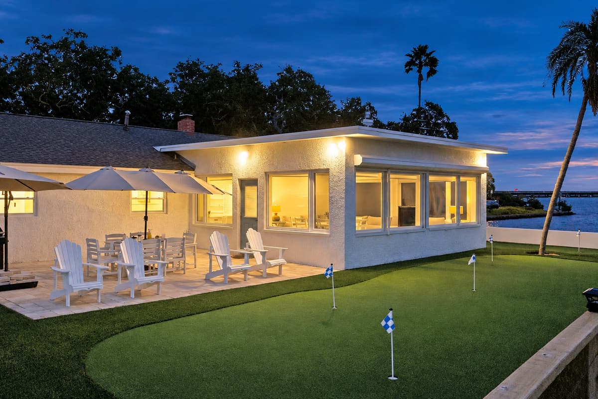 Golf by day, glow by night. The putting green, patio and sunroom light up after sunset. Pour a drink, sink a putt and listen to the water a few steps away.