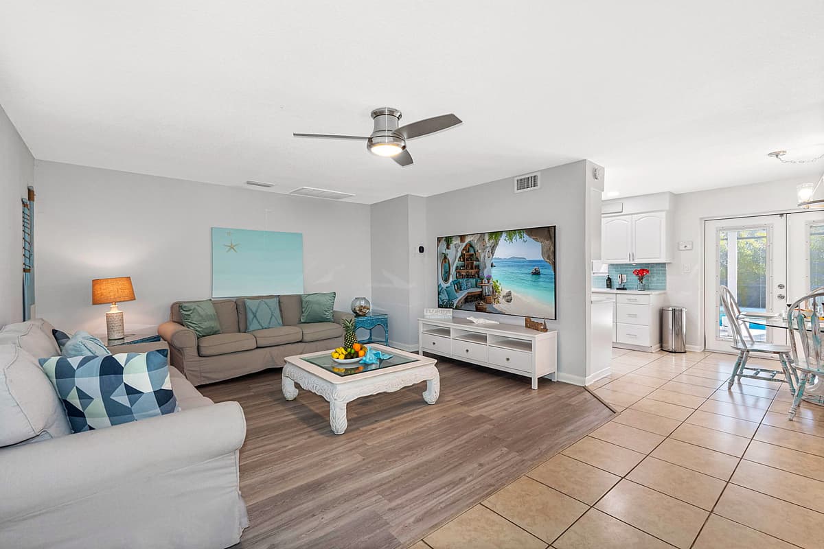The soothing color palette and beach-themed décor immediately create a calm and welcoming atmosphere.