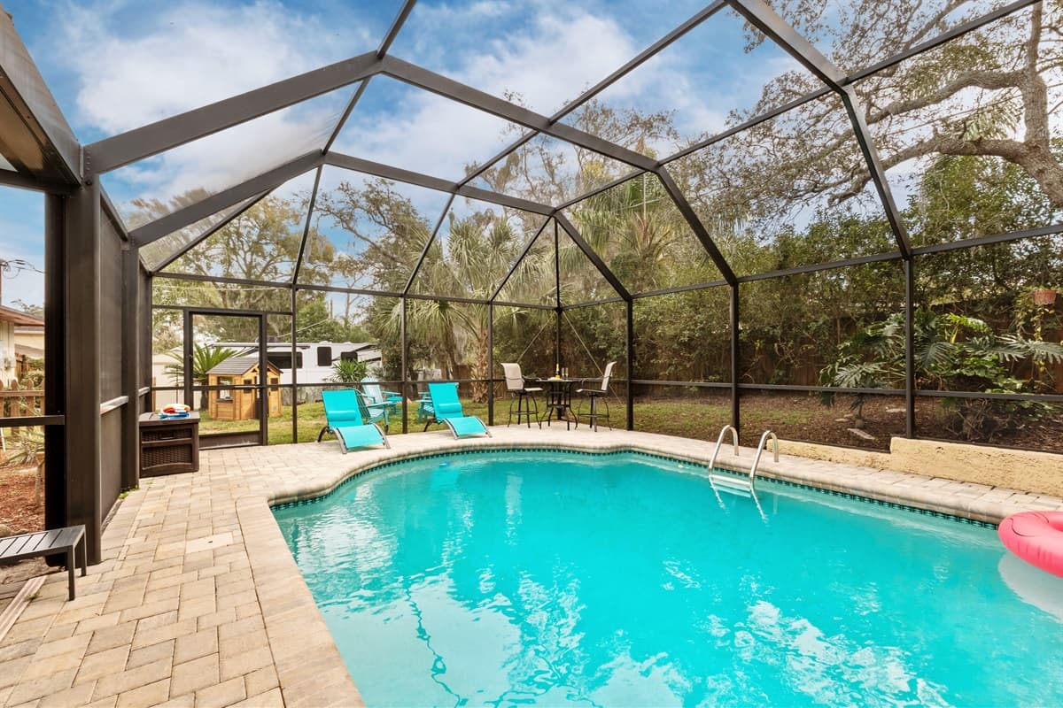 The heated pool assumes a fresh and enchanting allure.