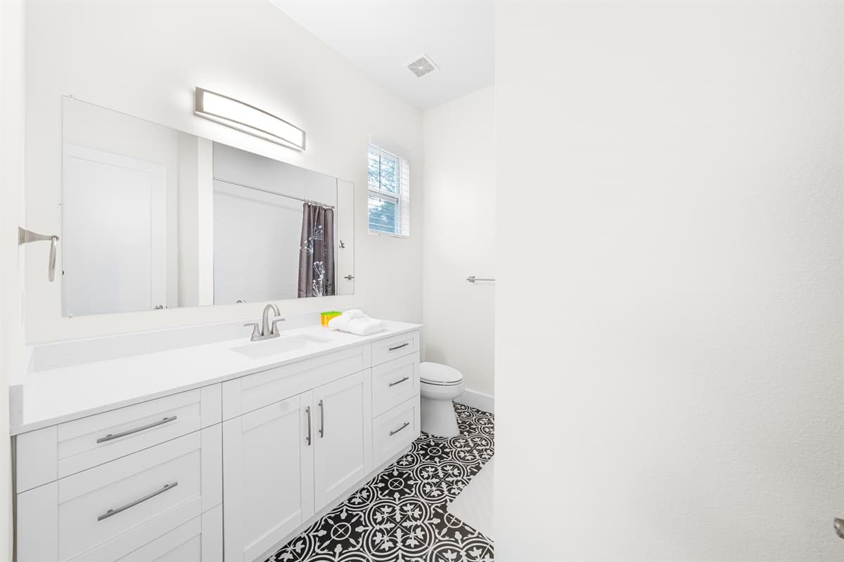 Double vanity bathroom with ample space and contemporary design.