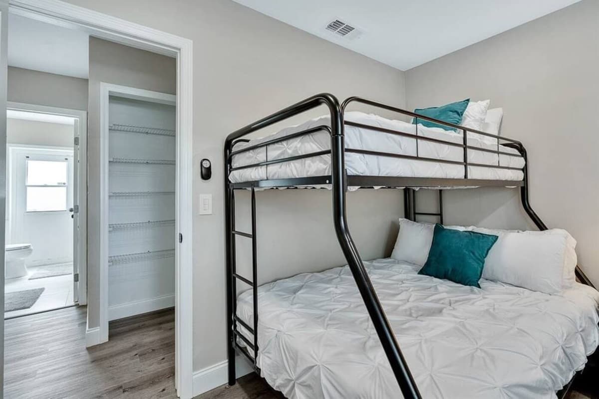 Bunkbed and a queen size bed for a small family or a group of friends who wants to hang out and sleep in one room. It is very spacious and has drawers for storage. If you are interested to book this house, Send us a message now!