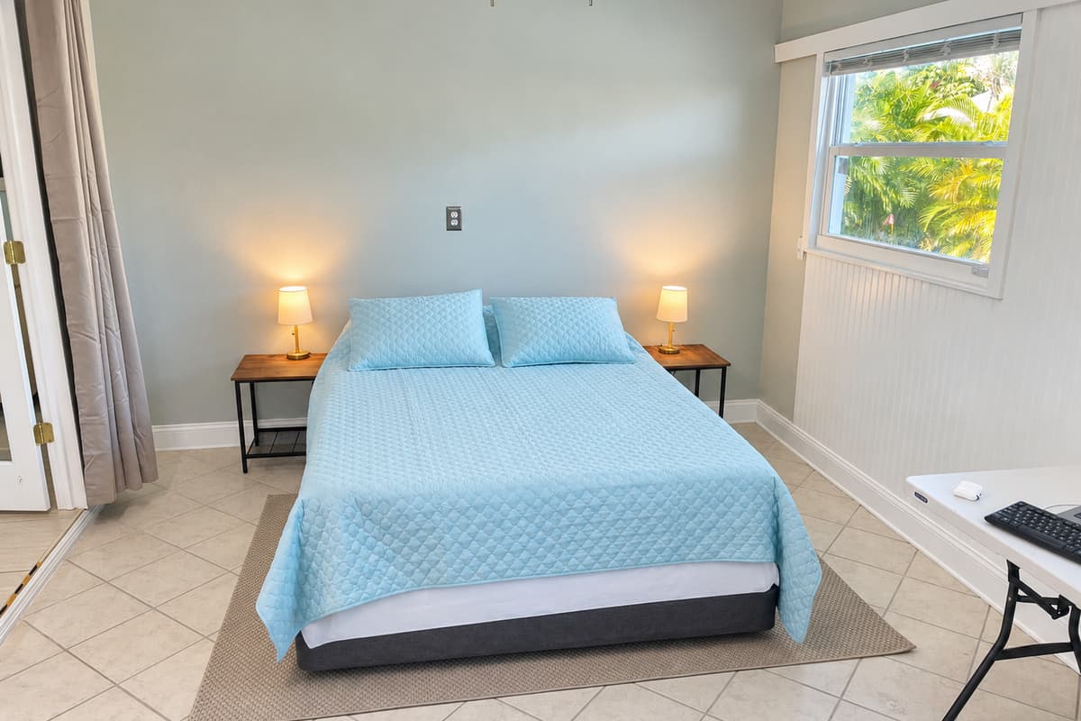 Soft lighting and plush bedding create a cozy and inviting atmosphere, ensuring a relaxing stay.