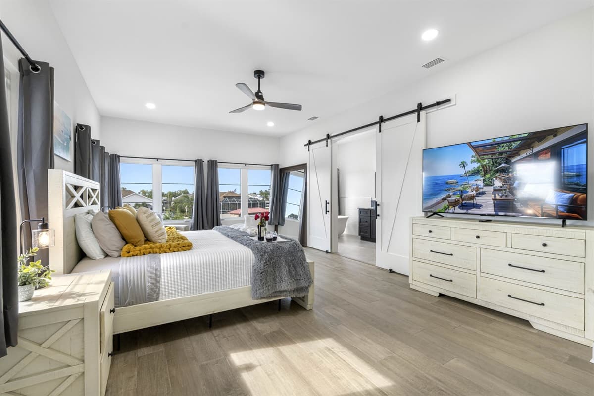 This king bedroom offers tranquility and comfort with elegant furnishings.