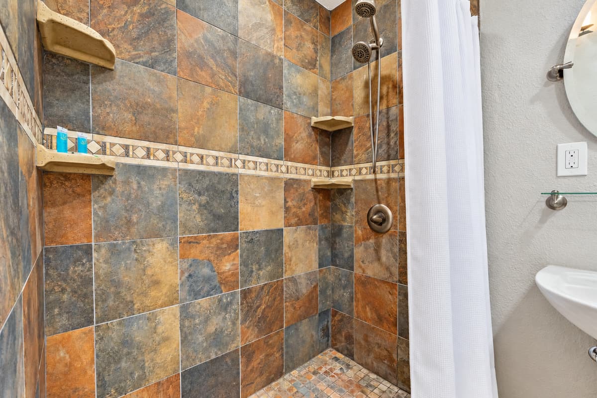 Experience the epitome of relaxation and sophistication in the en suite bathroom of the bunk bedroom