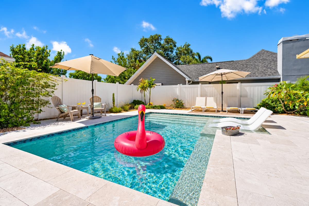 Kick back on a comfy lounger or float the day away—this backyard is built for fun and relaxation.
