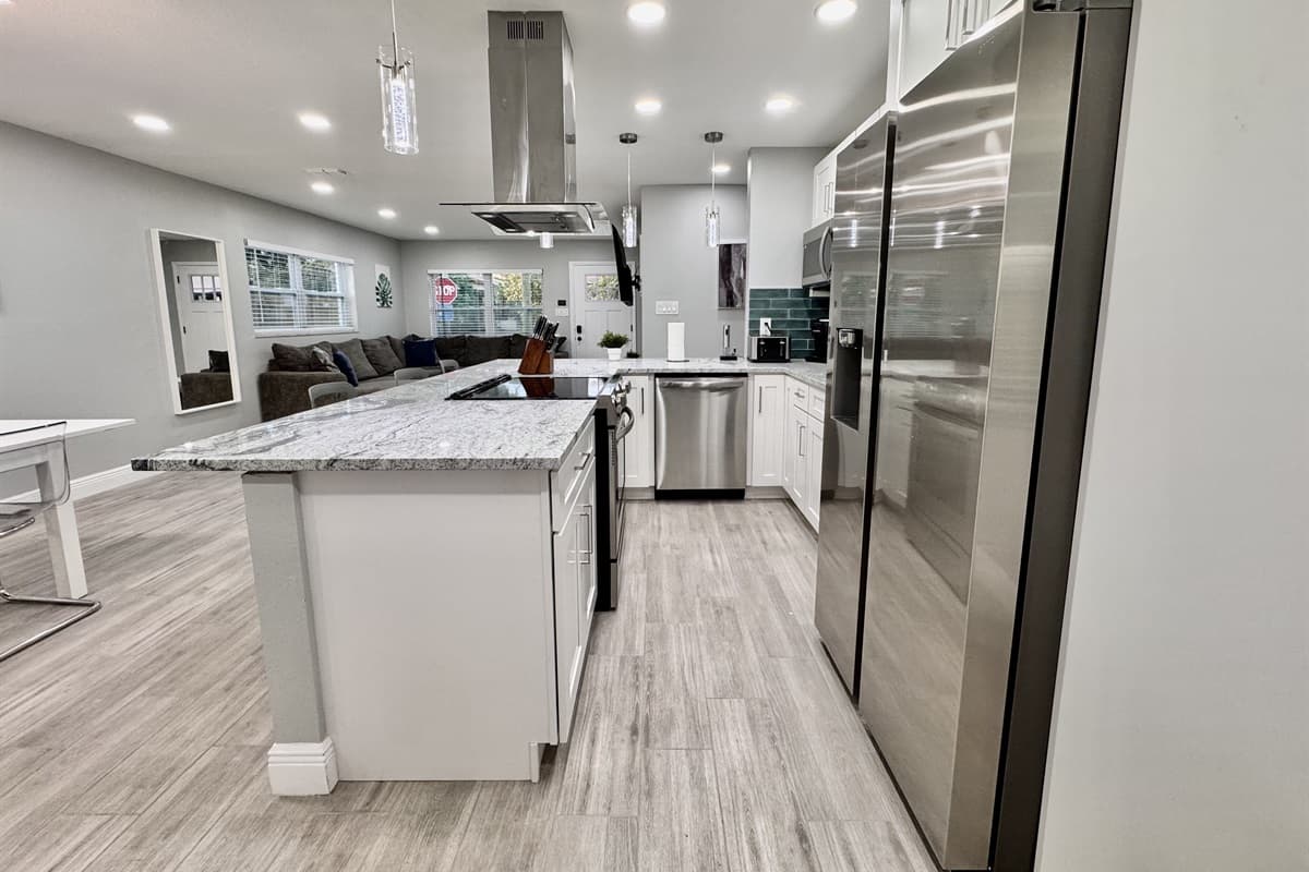 The fully equipped kitchen, boasting brand-new stainless-steel appliances that are as sleek as they are efficient.