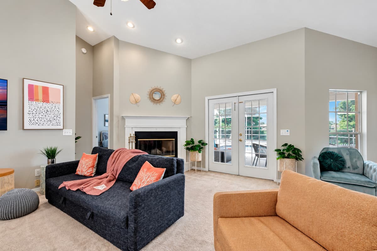 For a touch of whimsy and coziness, you'll find pastel-colored throw pillows scattered across the sofas and chairs.