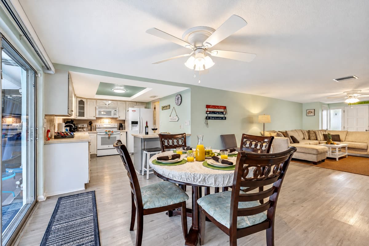 At the heart of this inviting setting is a spacious dining table that comfortably accommodates up to four people.
