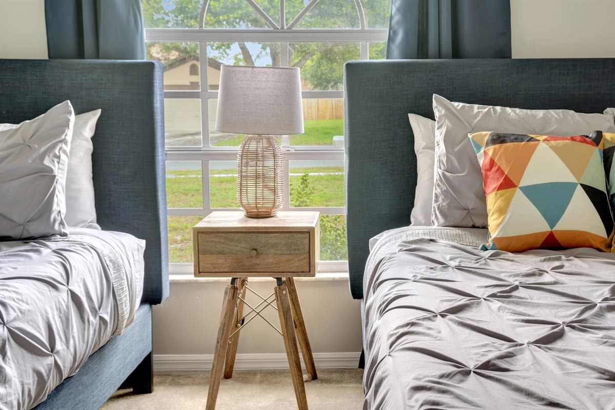 As the morning sun pours through the expansive window, it illuminates the room with a warm and welcoming glow.