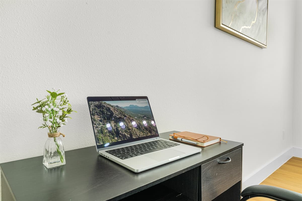 Close-up of workspace with desk and laptop—perfect for remote work.