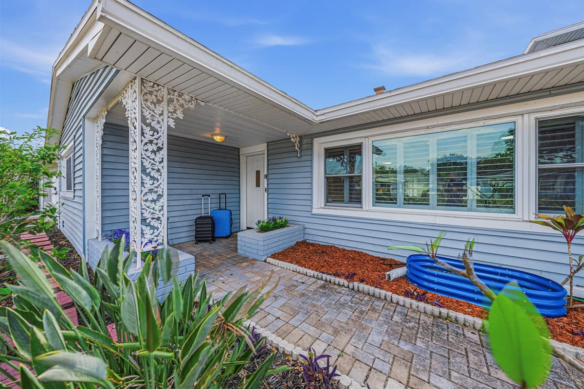 Front exterior view highlighting the home’s curb appeal, landscaping, and inviting design 
