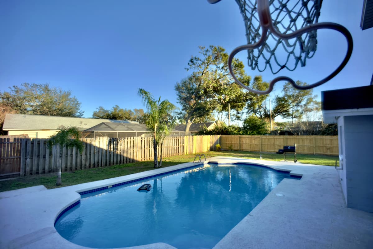 Step into a backyard oasis with a private pool, ideal for cooling off or basking in the sun. Challenge your friends to a game on the poolside basketball court, then gather around the BBQ grill for a perfect outdoor feast.