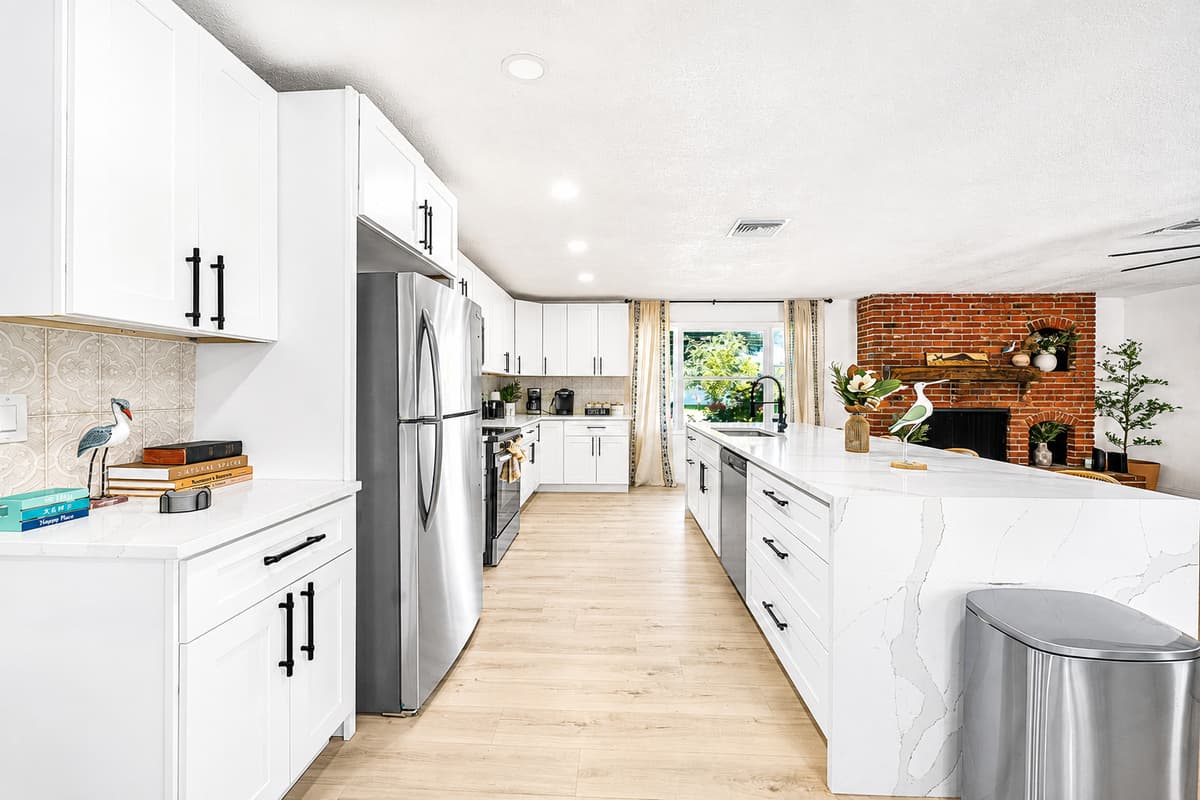 Two people can cook in here at the same time — island on one side, full run of counter on the other.