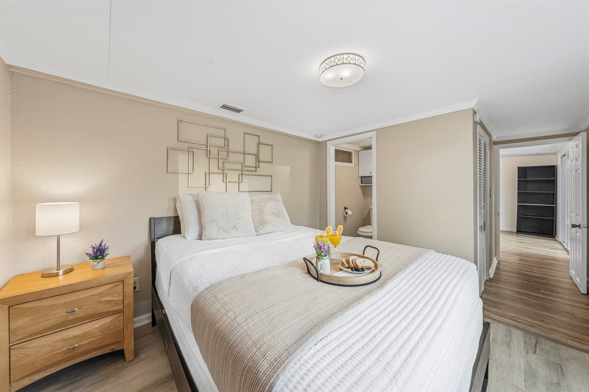 Spacious master suite with comfortable furnishings and a relaxing atmosphere.