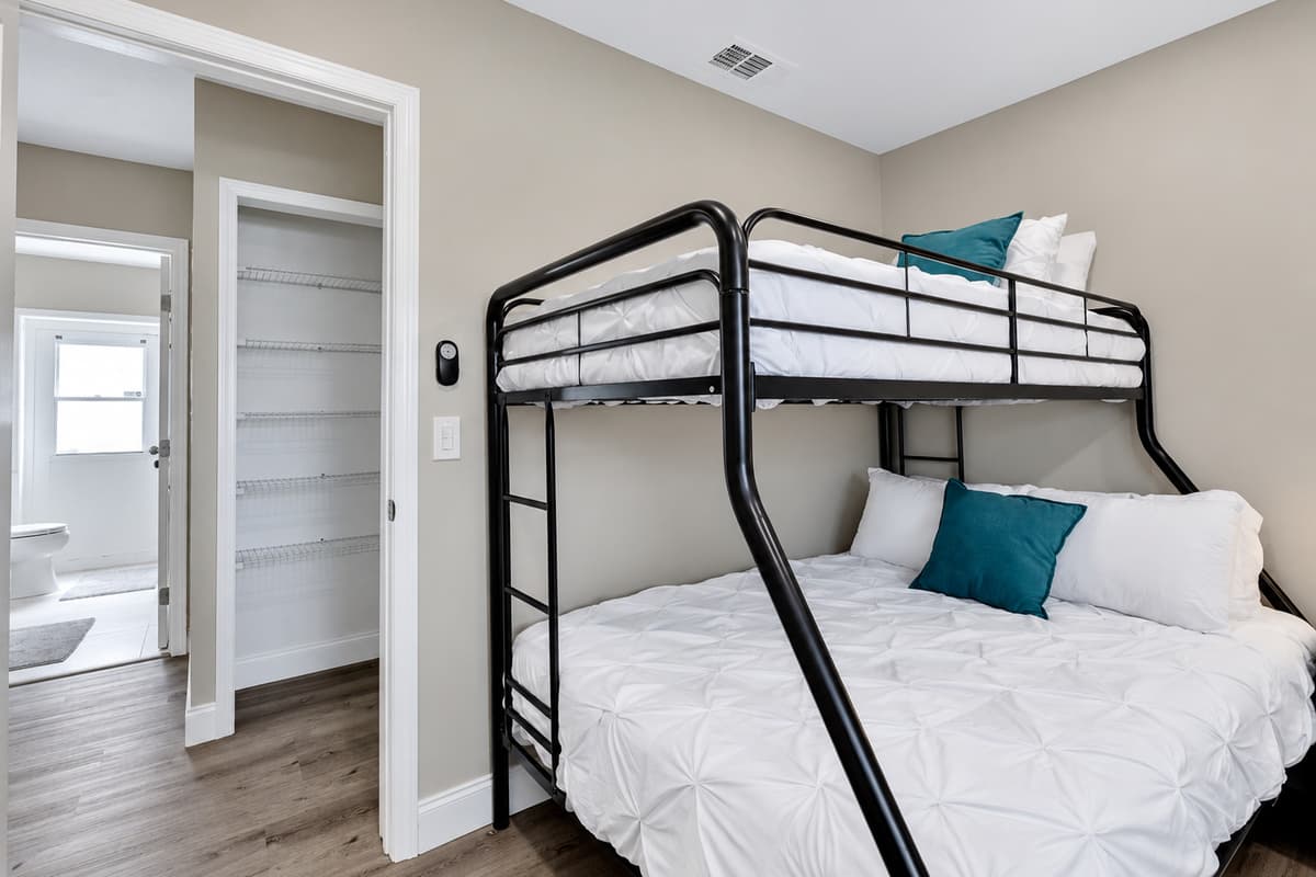 Bunkbed and a queen size bed for a small family or a group of friends who wants to hang out and sleep in one room. It is very spacious and has drawers for storage. If you are interested to book this house, Send us a message now!