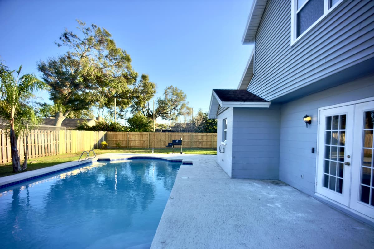 Whether you're swimming, lounging, or simply enjoying the peaceful atmosphere, this backyard offers a stunning escape right at home.