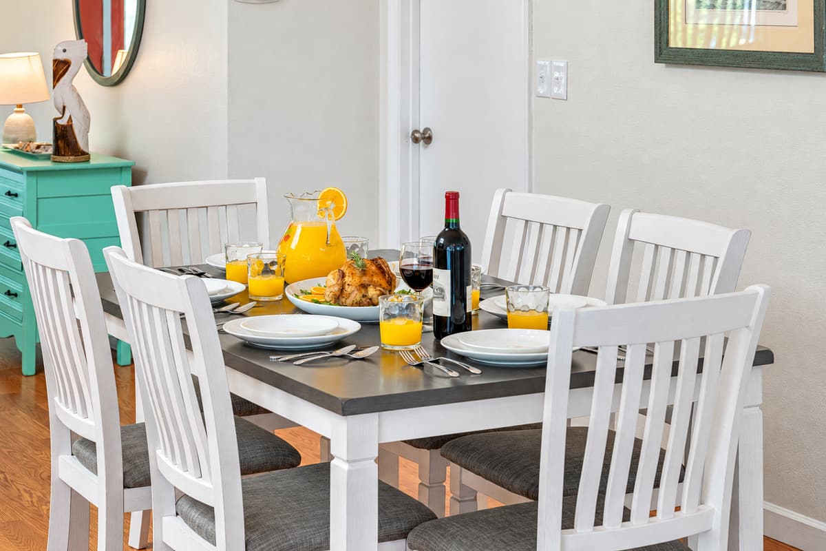 The table's design balances form and function, offering ample seating while maintaining a sleek profile that suits both casual dining and more formal occasions.