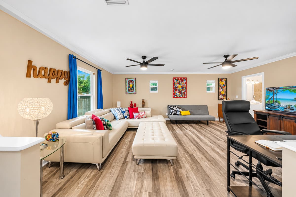Wide-angle view of the main living area showcasing generous seating, open design, and welcoming atmosphere.