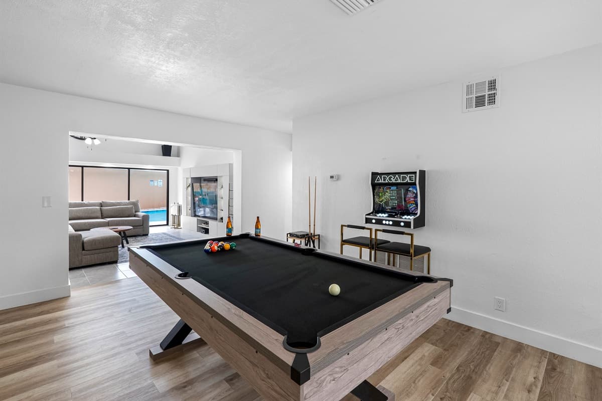 Cue up your next match! This bright and modern game room delivers classic entertainment with a stylish twist.