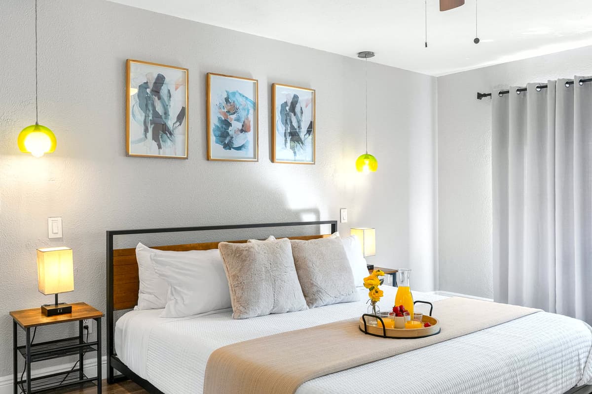 High-quality finishes, neutral tones, and open space make this suite feel fresh and inviting.