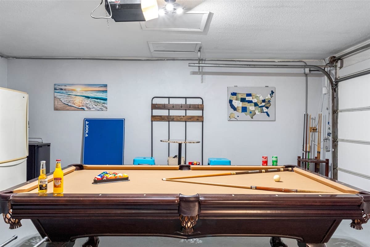 The pool table offers a smooth surface for lively matches and endless hours of entertainment.