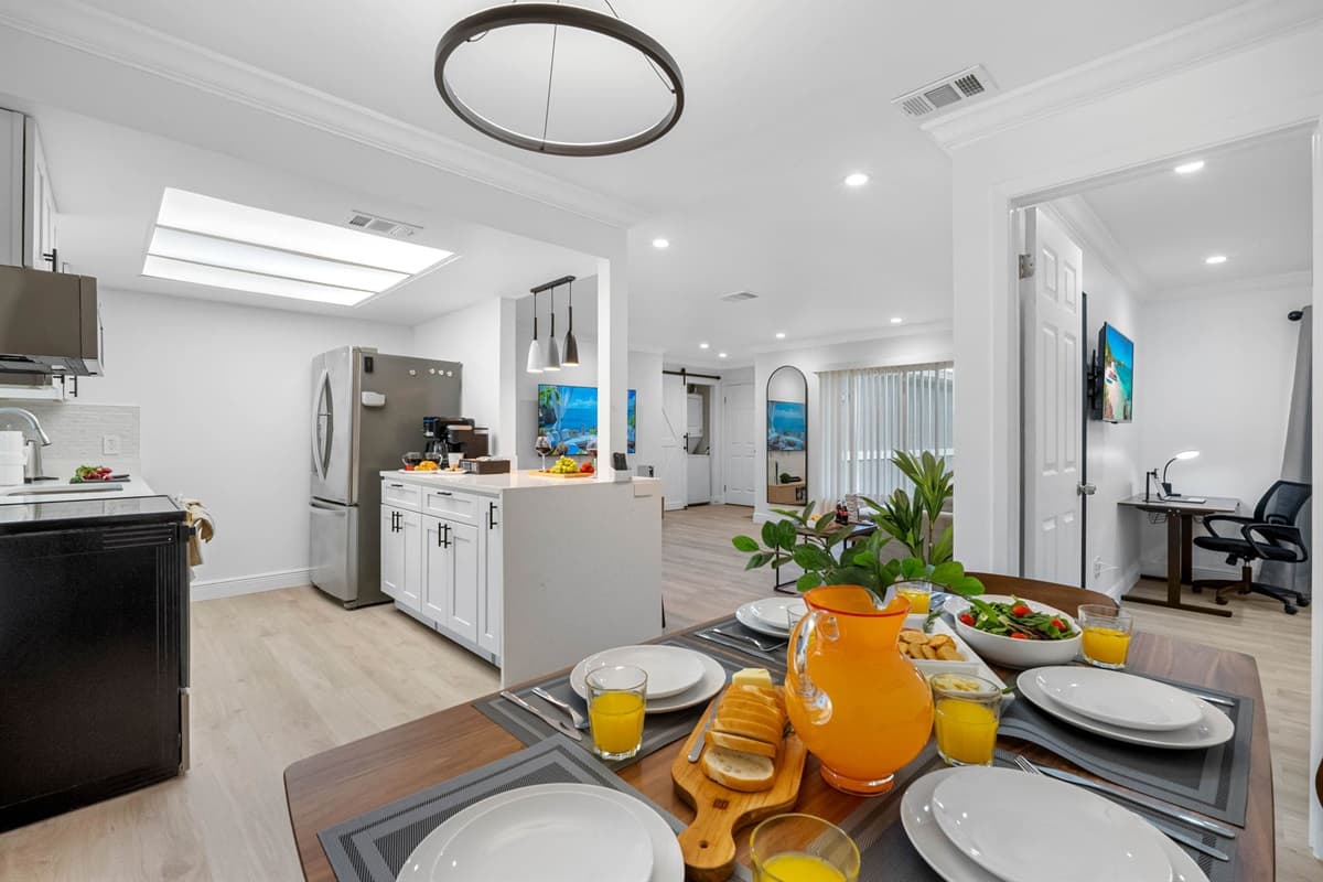 Gather around this cheerful dining space, filled with natural light and cozy vibes for every meal.