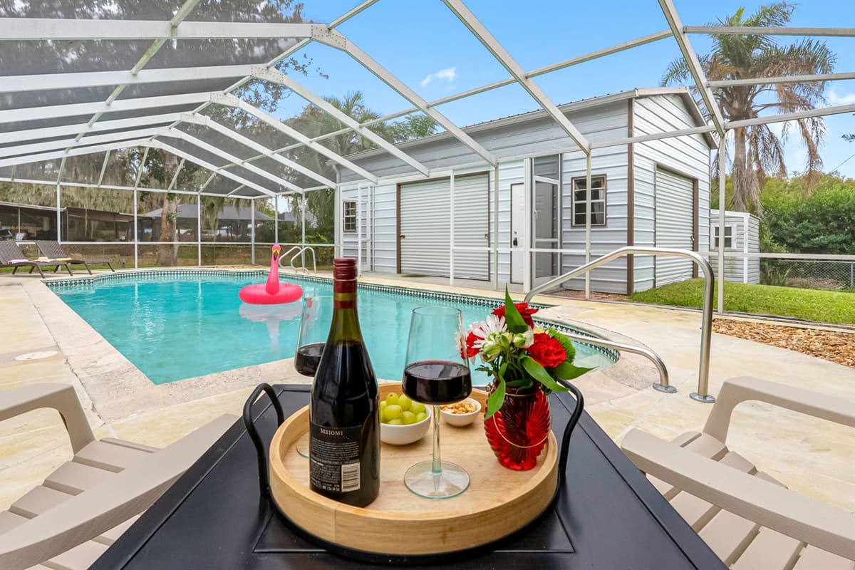 Enjoy a clean, refreshing pool enclosed in a screened patio for added comfort and privacy.