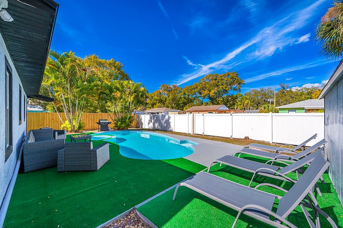 Beautiful fully fenced backyard with magnificent heated pool with seating area.