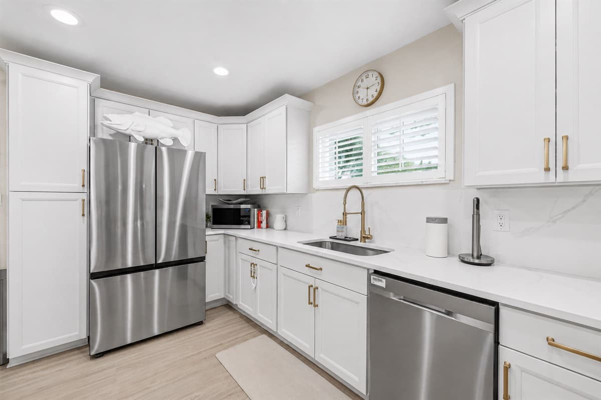 Stylish kitchen featuring stainless steel appliances, modern fixtures, and plenty of prep and storage space.