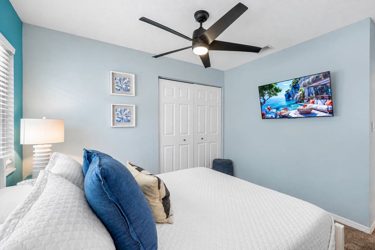 This queen bedroom blends clean lines, soft lighting, and ocean-inspired tones for a soothing night’s rest.