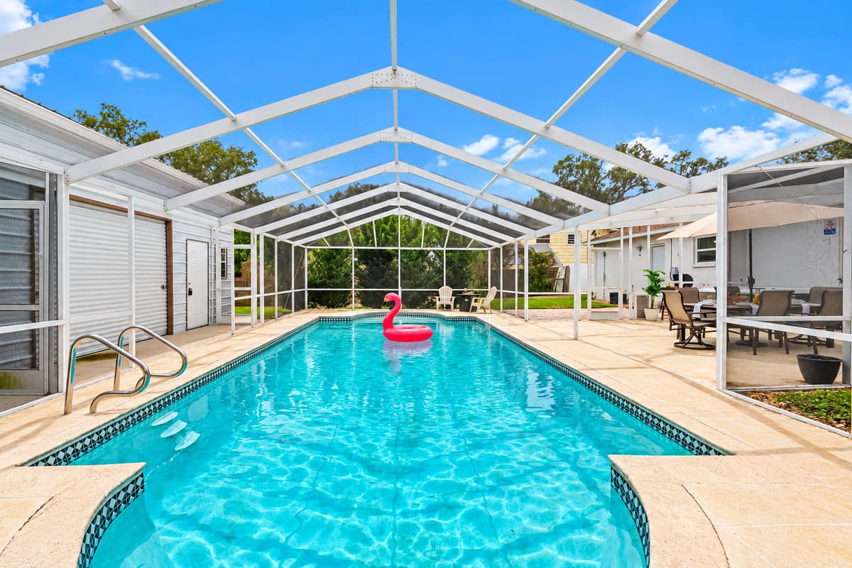 Resort-style pool area featuring comfortable loungers and plenty of space to unwind.