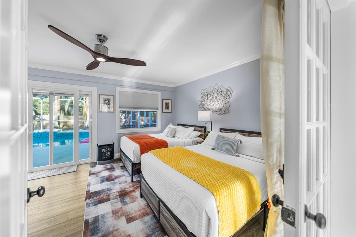 Perfect for group stays, this bedroom includes two double beds and a relaxed, airy layout.