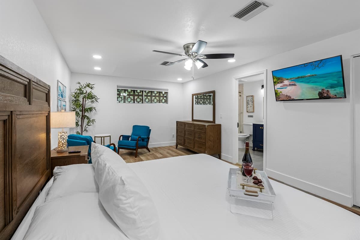Drift off in total comfort on a cloud-soft bed in this serene, hotel-worthy bedroom—complete with modern amenities and spa-like lighting.